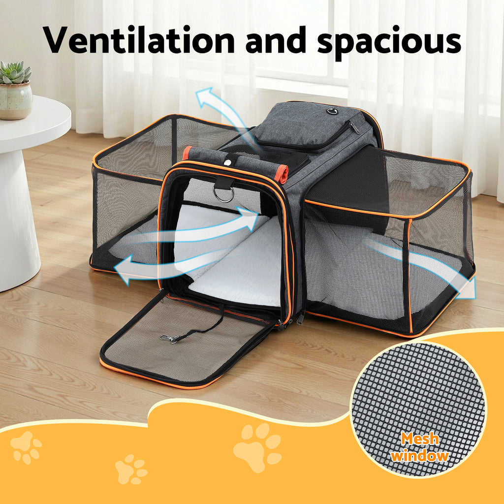Pet carrier with mesh window and ventilation system on a wooden floor.
