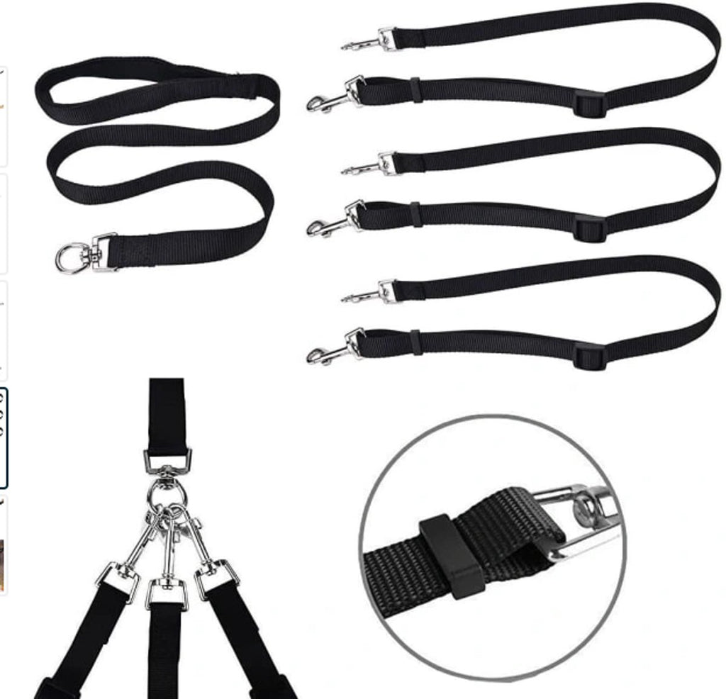 Set of black straps with metal clasps on a white background