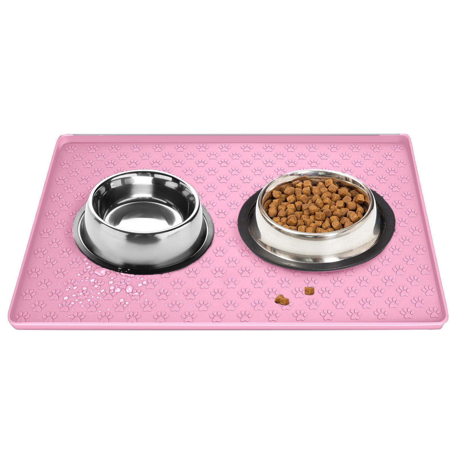 Pink pet feeding mat with two stainless steel bowls, one empty and one with kibble.