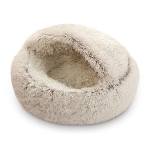 Fluffy beige pet bed on a white background
