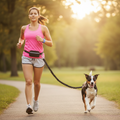 Woman running with a dog on a path in a park