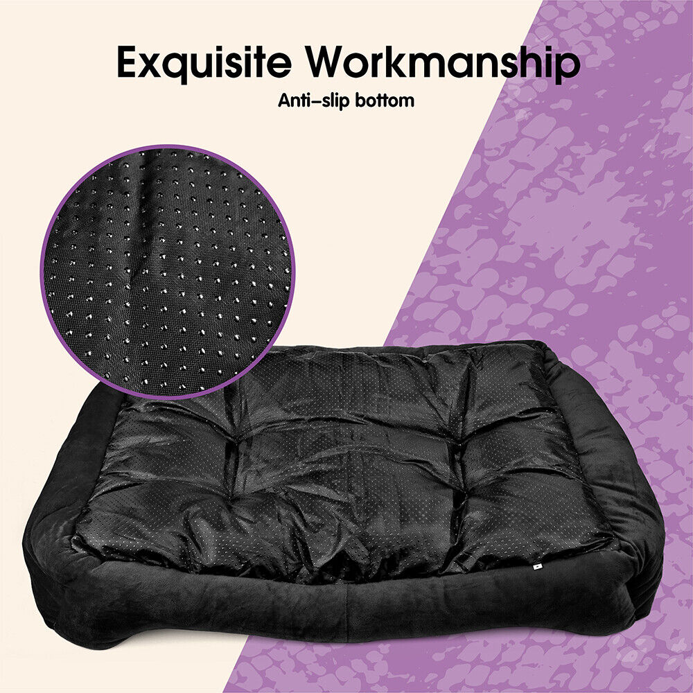 Black pet bed with anti-slip bottom feature on a purple and beige background