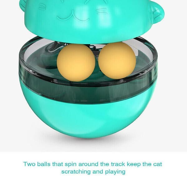 Teal cat toy with two yellow balls inside on a white background