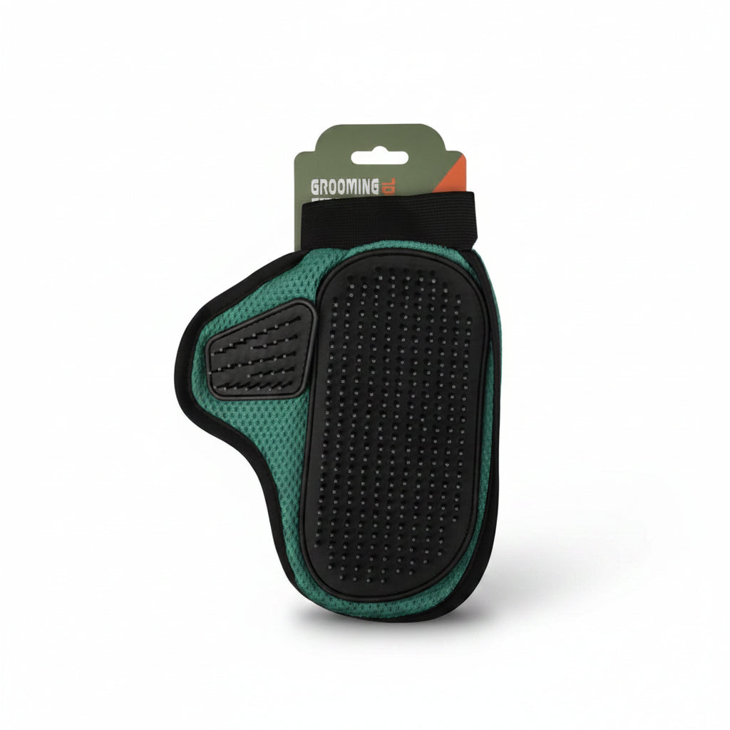 Pet grooming brush with green handle and black bristles on a white background