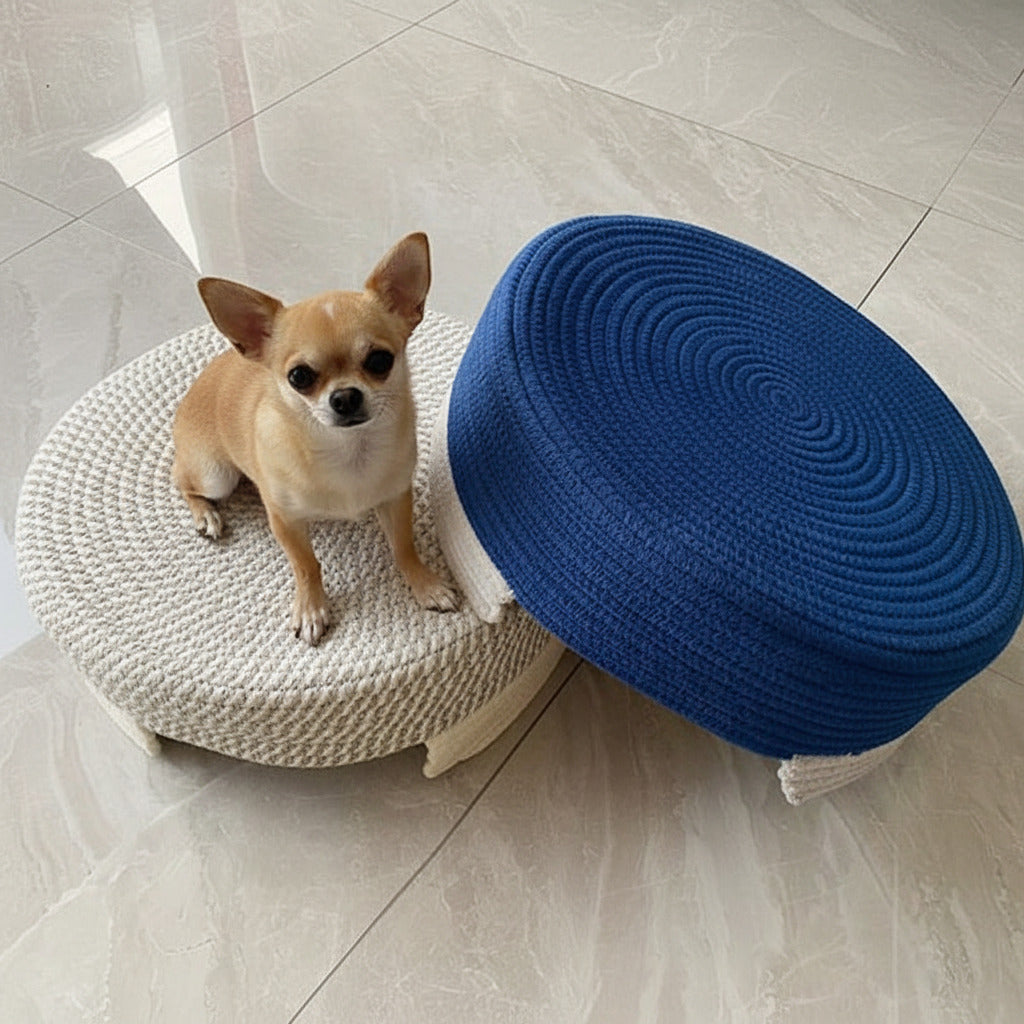 Two woven stools, one blue and one beige, on a tiled floor.
