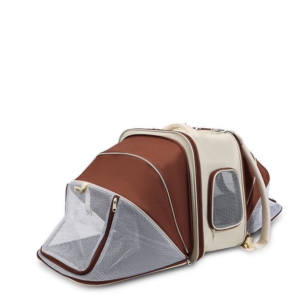 Brown and beige pet carrier with mesh sides on a white background