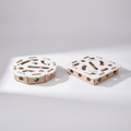 Two wooden puzzle pieces on a light gray background